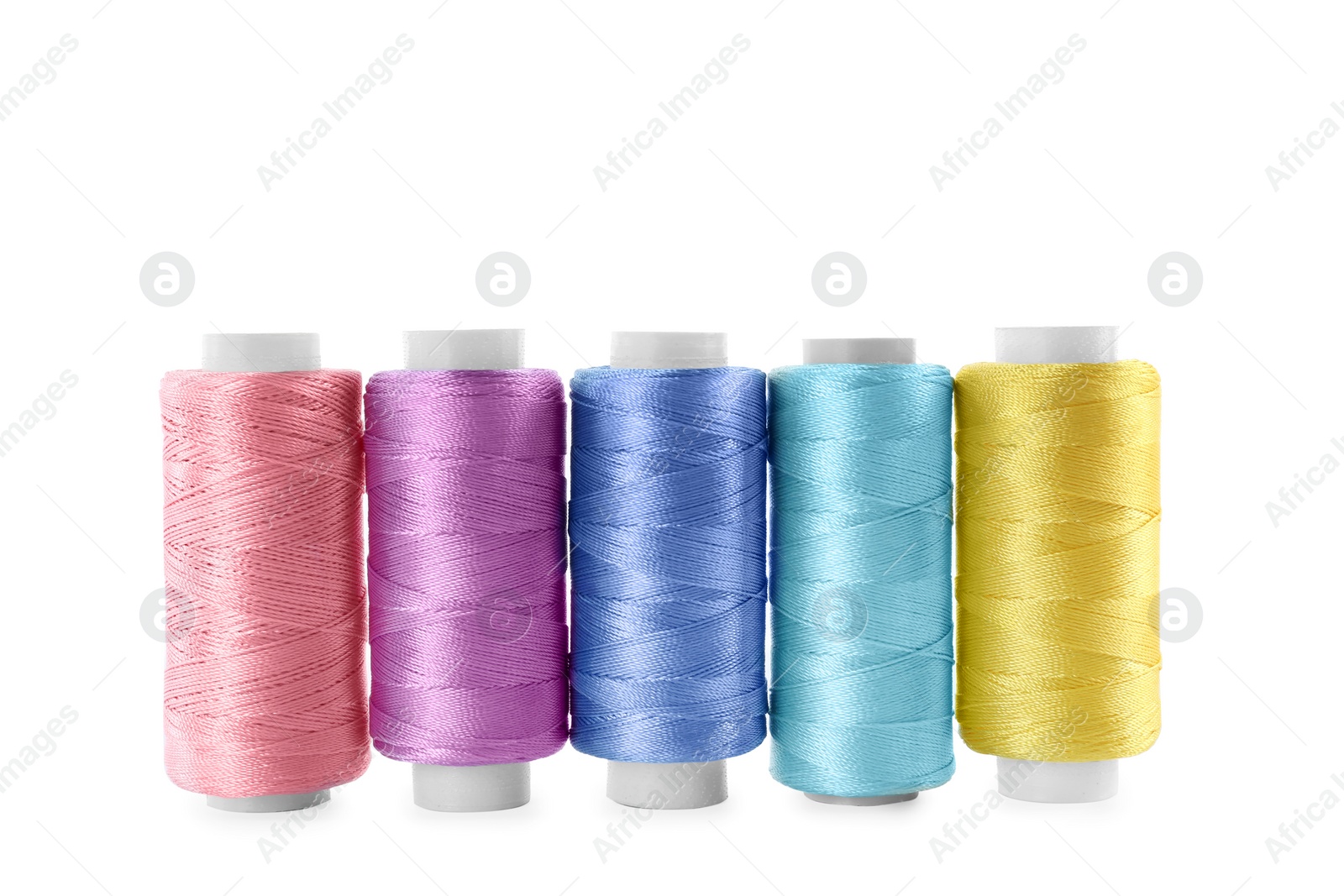 Photo of Set of color sewing threads isolated on white