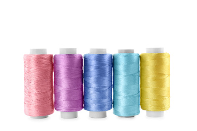 Photo of Set of color sewing threads isolated on white