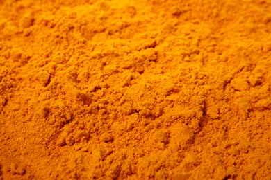 Photo of Aromatic saffron powder as background, closeup view