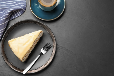 Photo of Delicious cake with condensed milk on black table, flat lay. Space for text