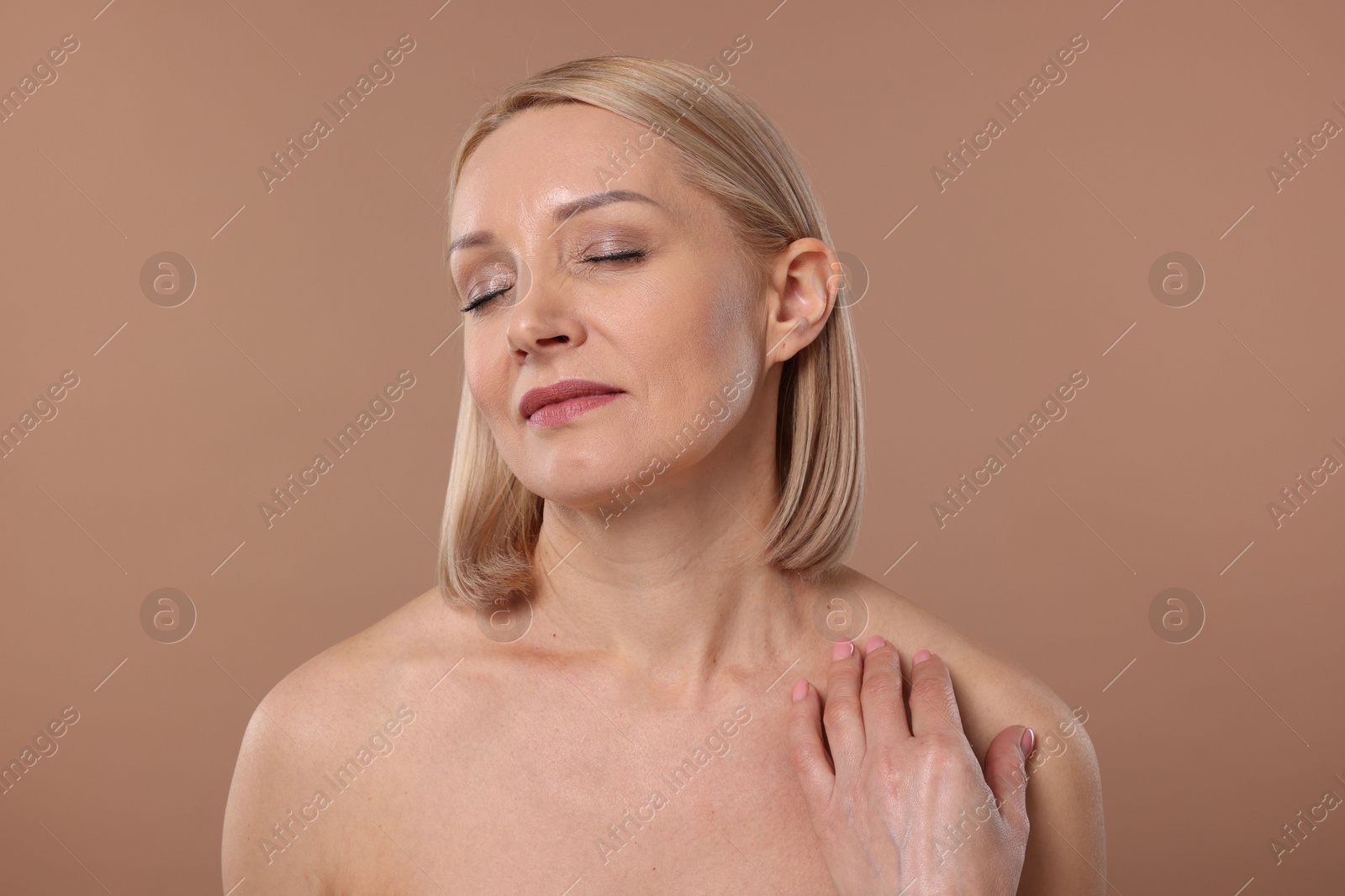 Photo of Beautiful woman with healthy skin on beige background