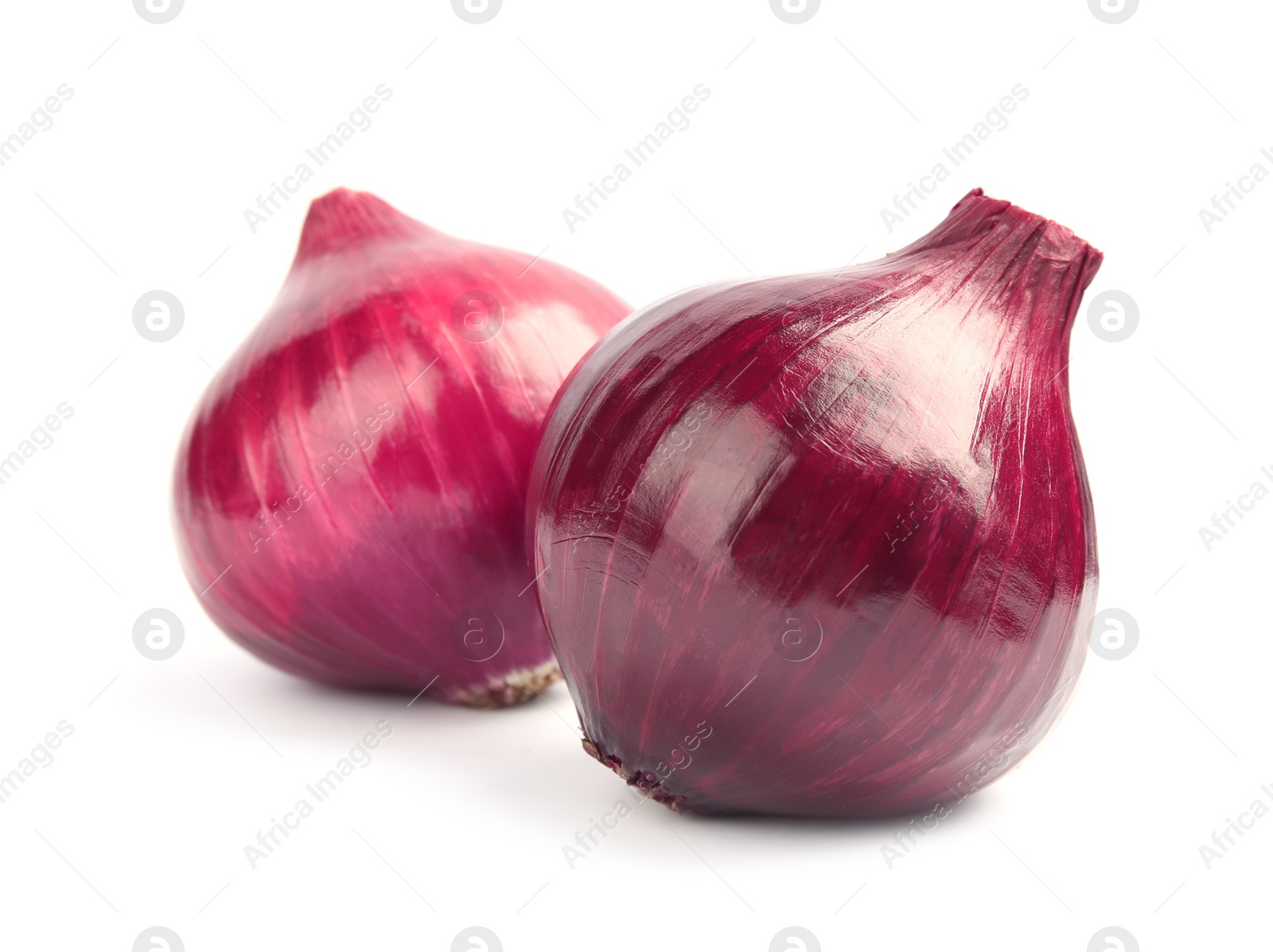 Photo of Ripe red onions on white background