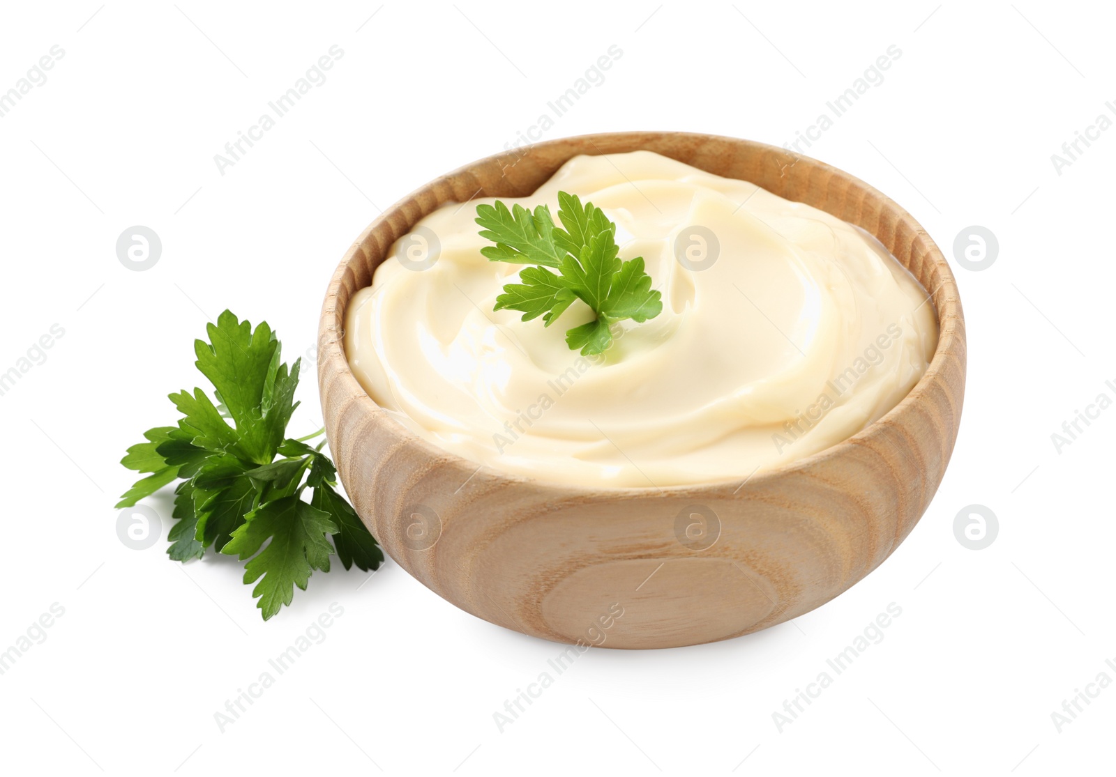 Photo of Bowl with delicious mayonnaise and parsley on white background