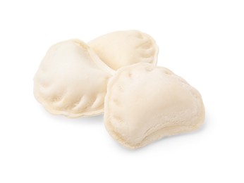 Photo of Heap of raw dumplings (varenyky) with tasty filling on white background