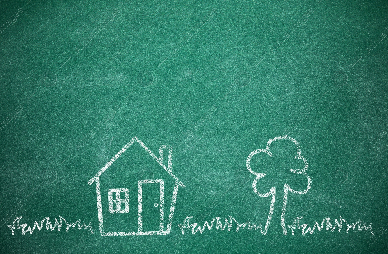 Image of House and tree drawn with chalk on school board