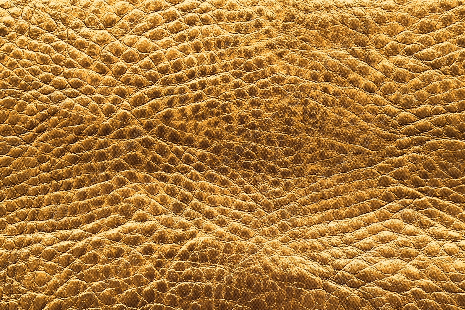 Image of Golden textured surface as background, closeup view