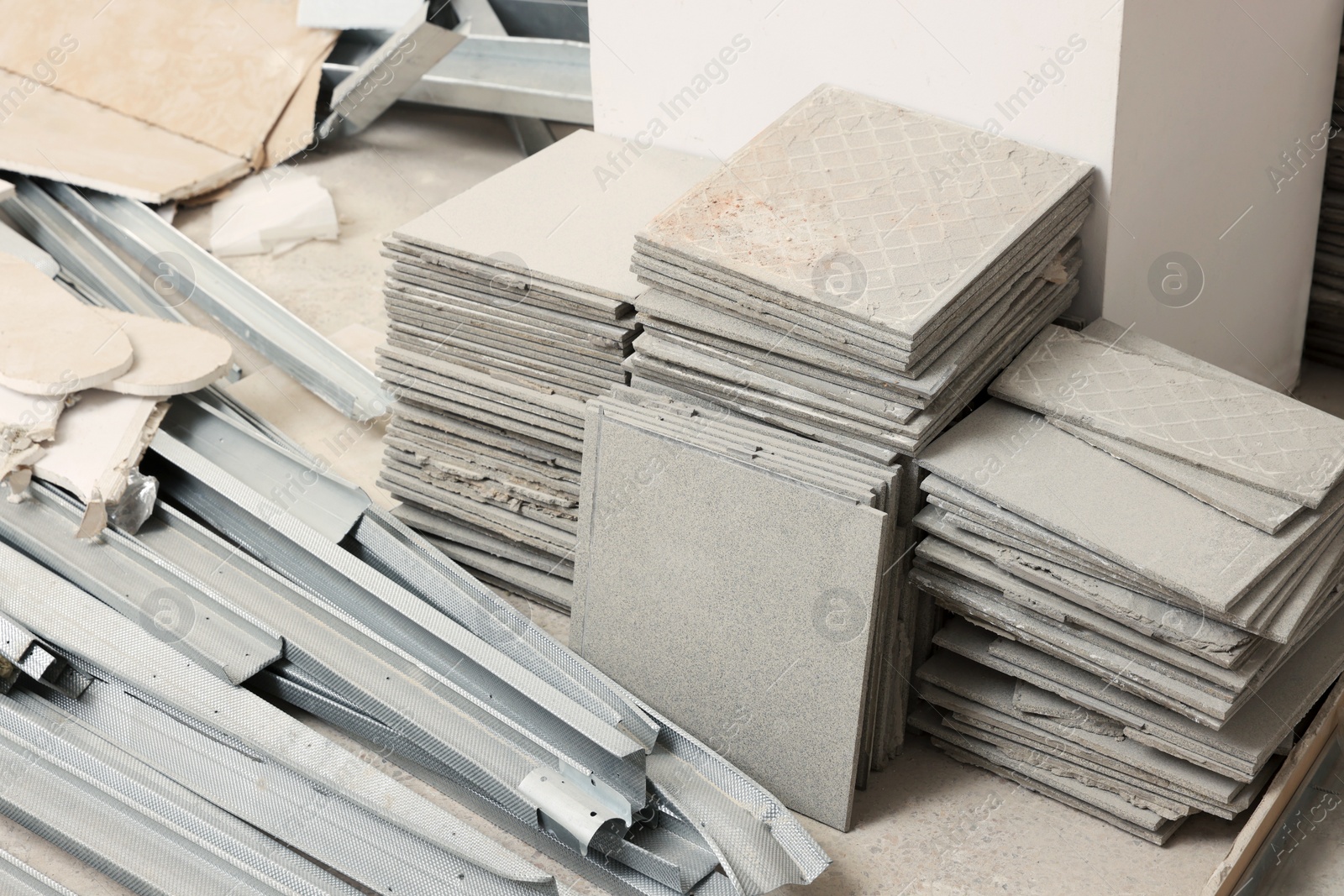 Photo of Building materials and tiles in room prepared for renovation