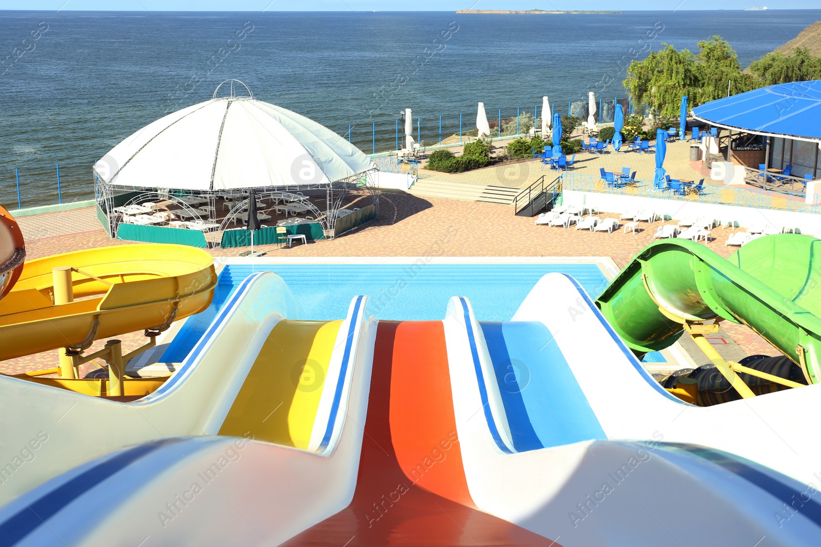 Photo of View from colorful slide in water park on sunny day