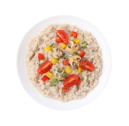 Photo of Delicious barley porridge with vegetables and microgreens in bowl isolated on white, top view