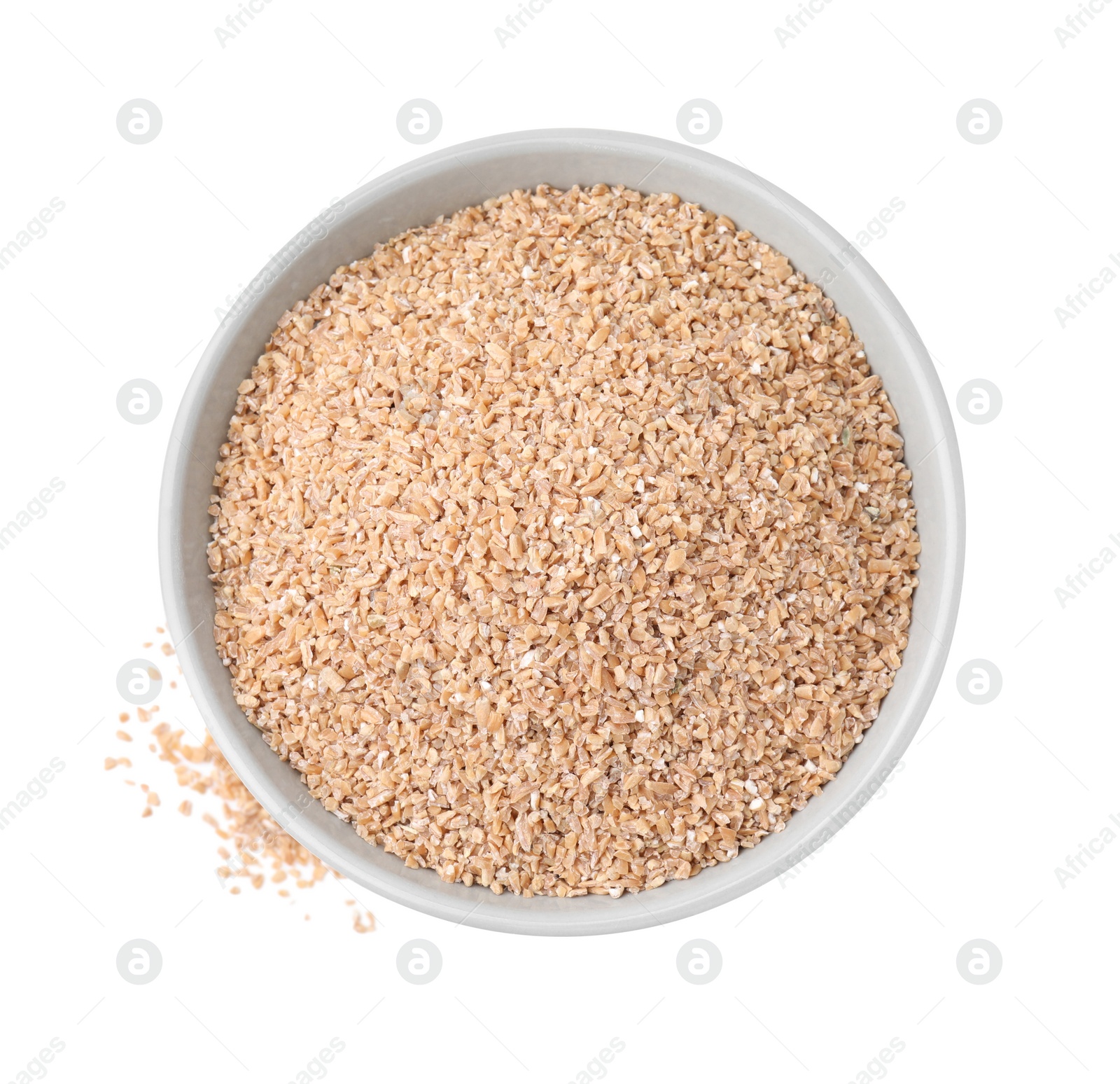 Photo of Dry wheat groats in bowl isolated on white, top view