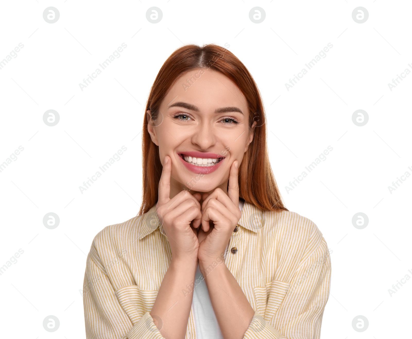 Photo of Beautiful woman showing her clean teeth and smiling on white background