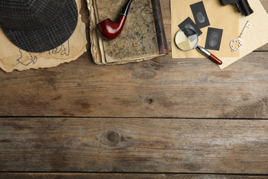 Photo of Composition with different vintage items on wooden background, space for text. Detective layout