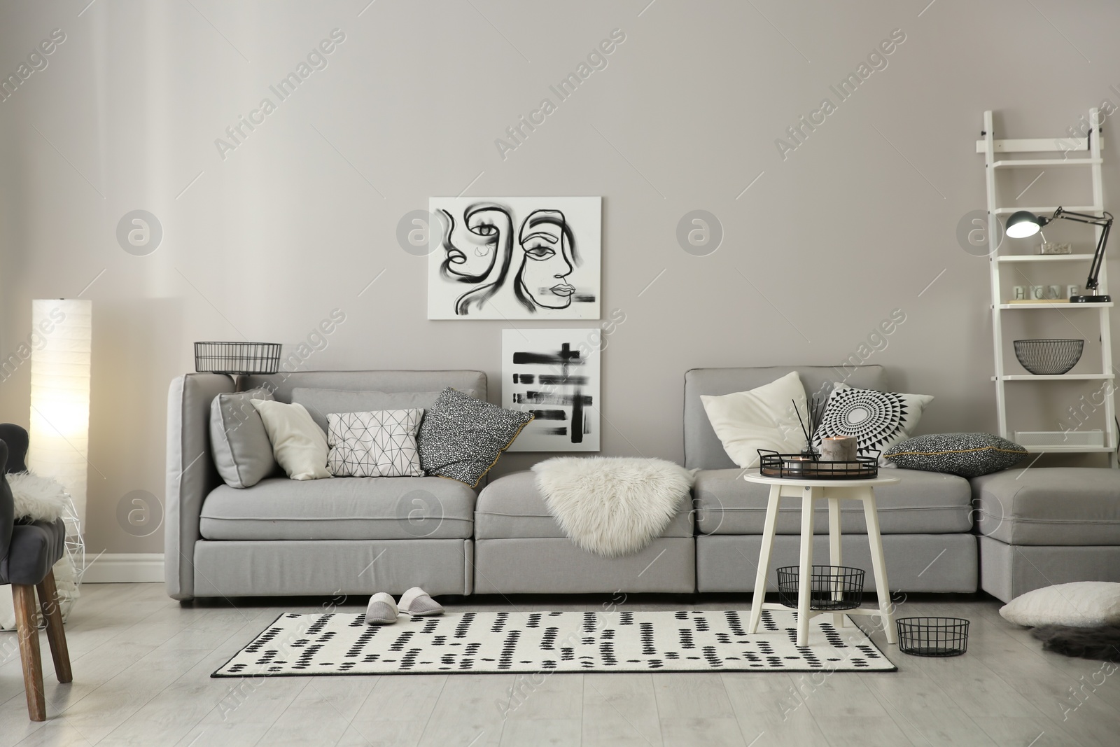 Photo of Cozy living room interior with big grey sofa