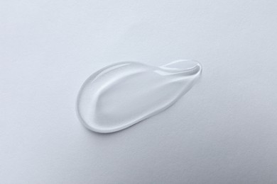 Swatch of cosmetic gel on white background, top view
