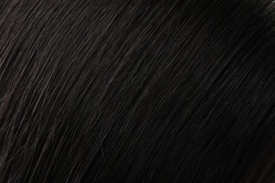 Closeup view of healthy dark woman`s hair