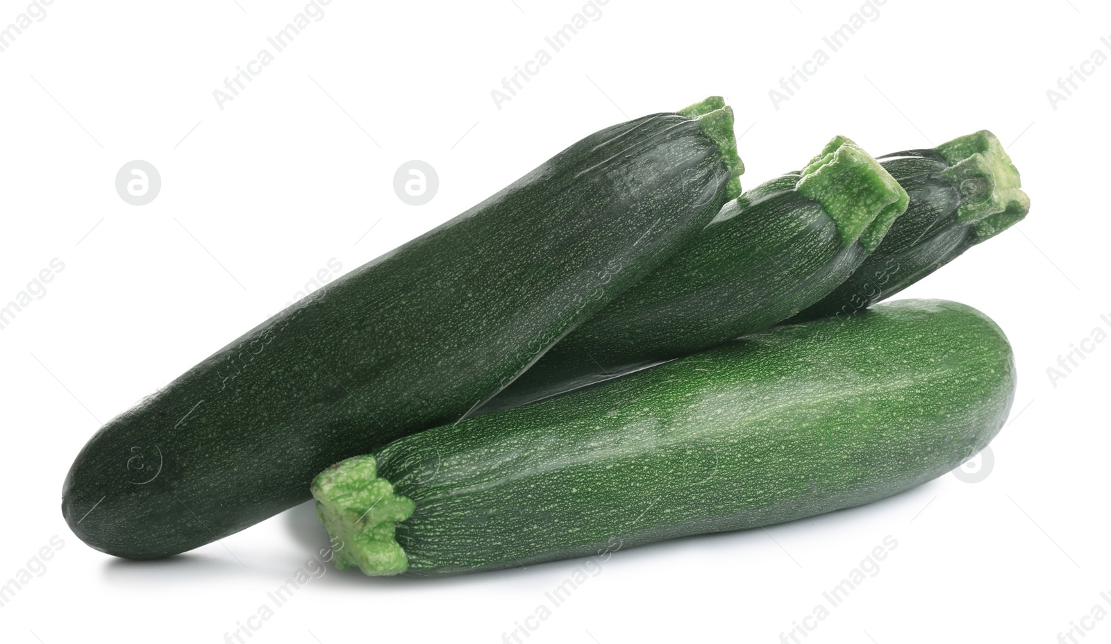 Photo of Fresh ripe green zucchinis isolated on white