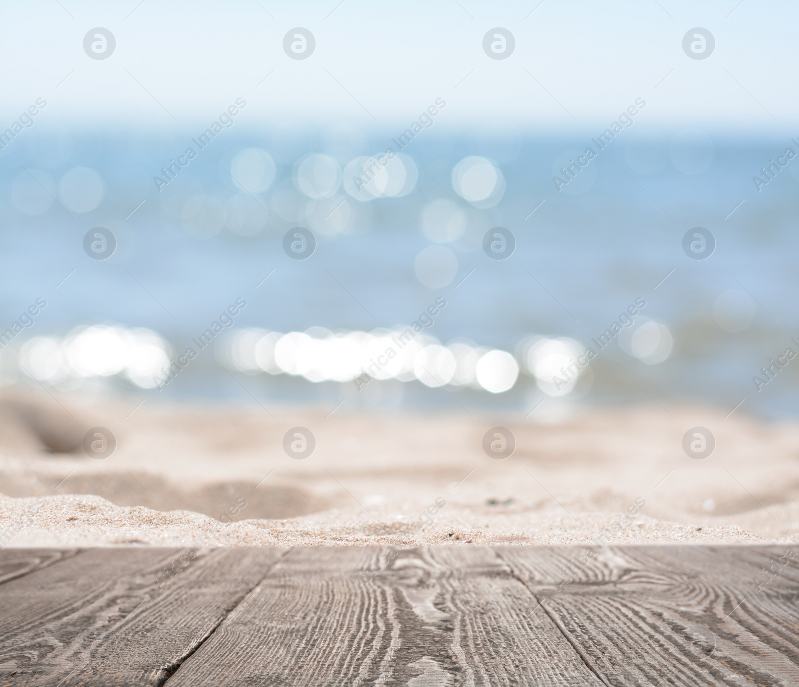 Image of Empty wooden surface on beach near sea. Summer season