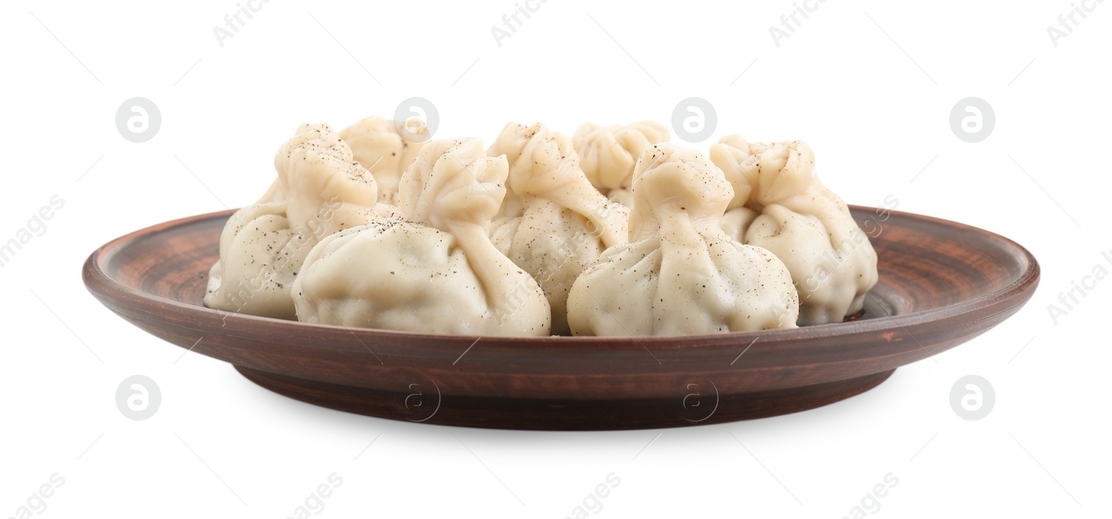 Photo of Plate with tasty fresh khinkali (dumplings) and spices isolated on white. Georgian cuisine