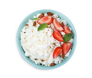 Photo of Fresh cottage cheese with strawberry and almond in bowl isolated on white, top view