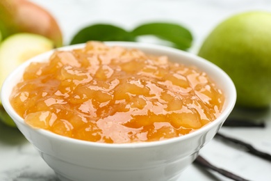 Delicious pear jam in bowl on table, closeup