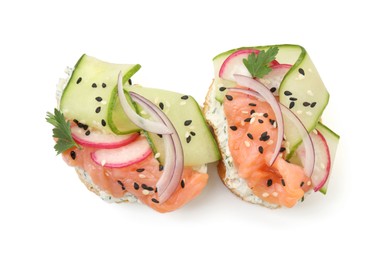 Tasty canapes with salmon, cucumber, radish and cream cheese isolated on white, top view