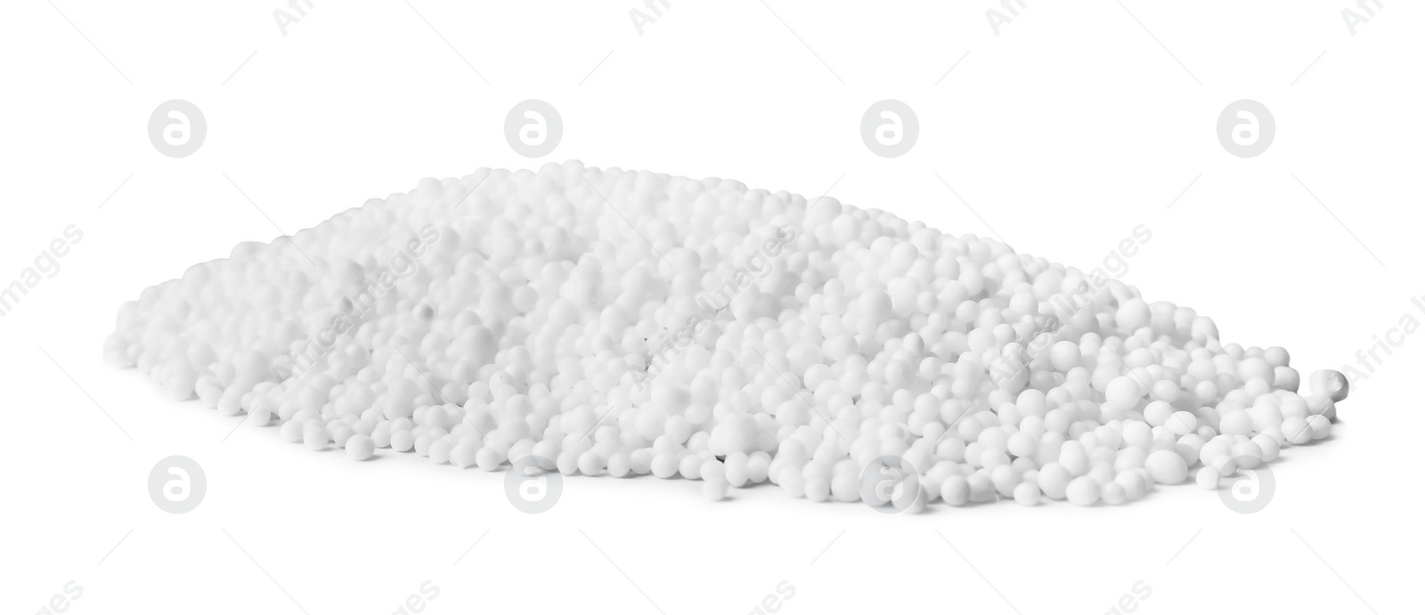 Photo of Pellets of ammonium nitrate on light grey background. Mineral fertilizer