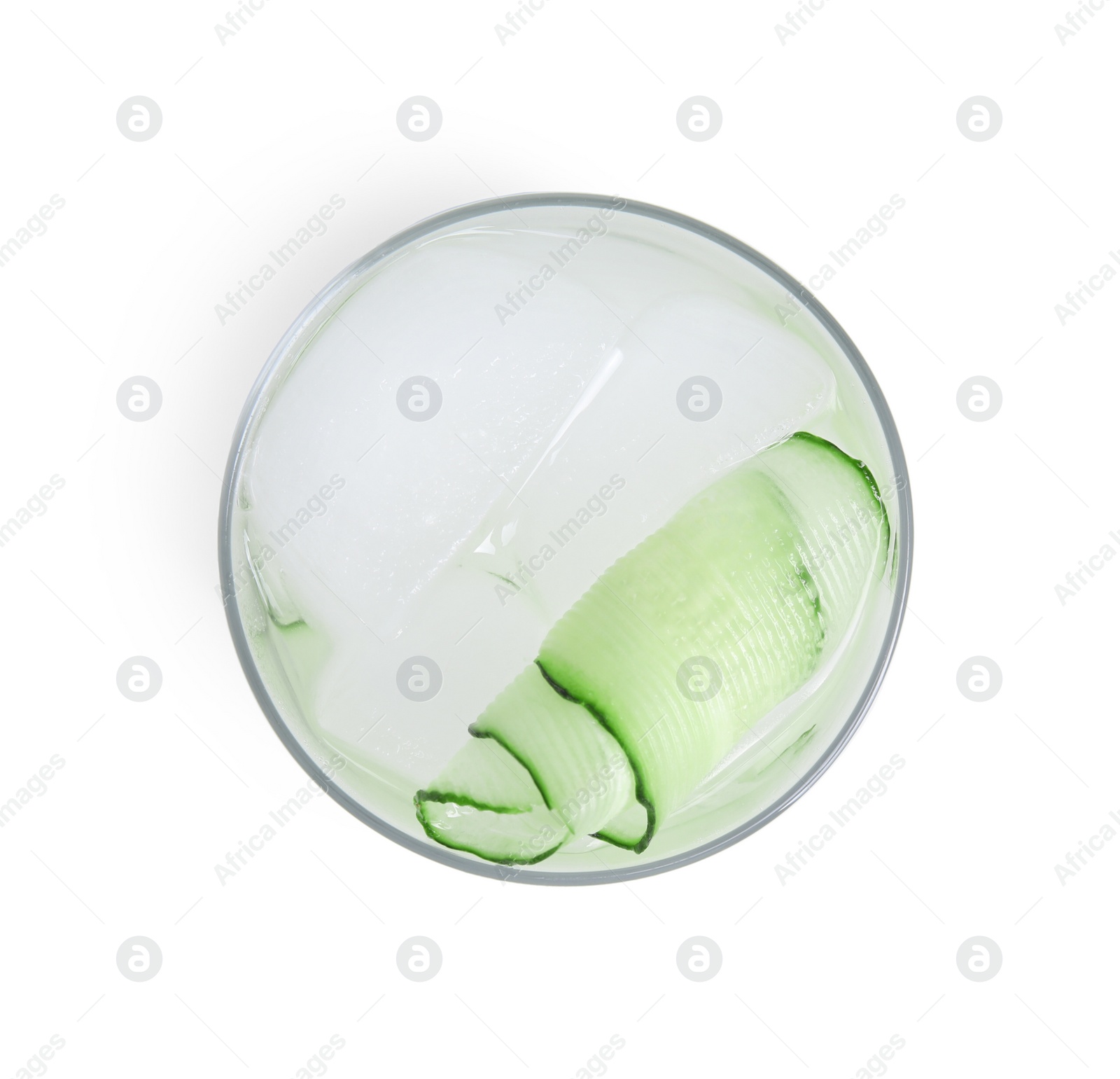 Photo of Tasty fresh cucumber water in glass isolated on white, top view