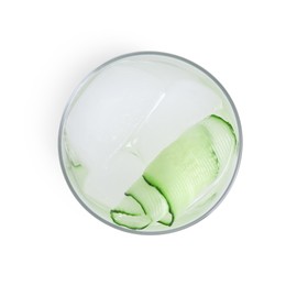 Photo of Tasty fresh cucumber water in glass isolated on white, top view