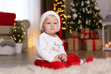 Baby in cute Christmas outfit at home