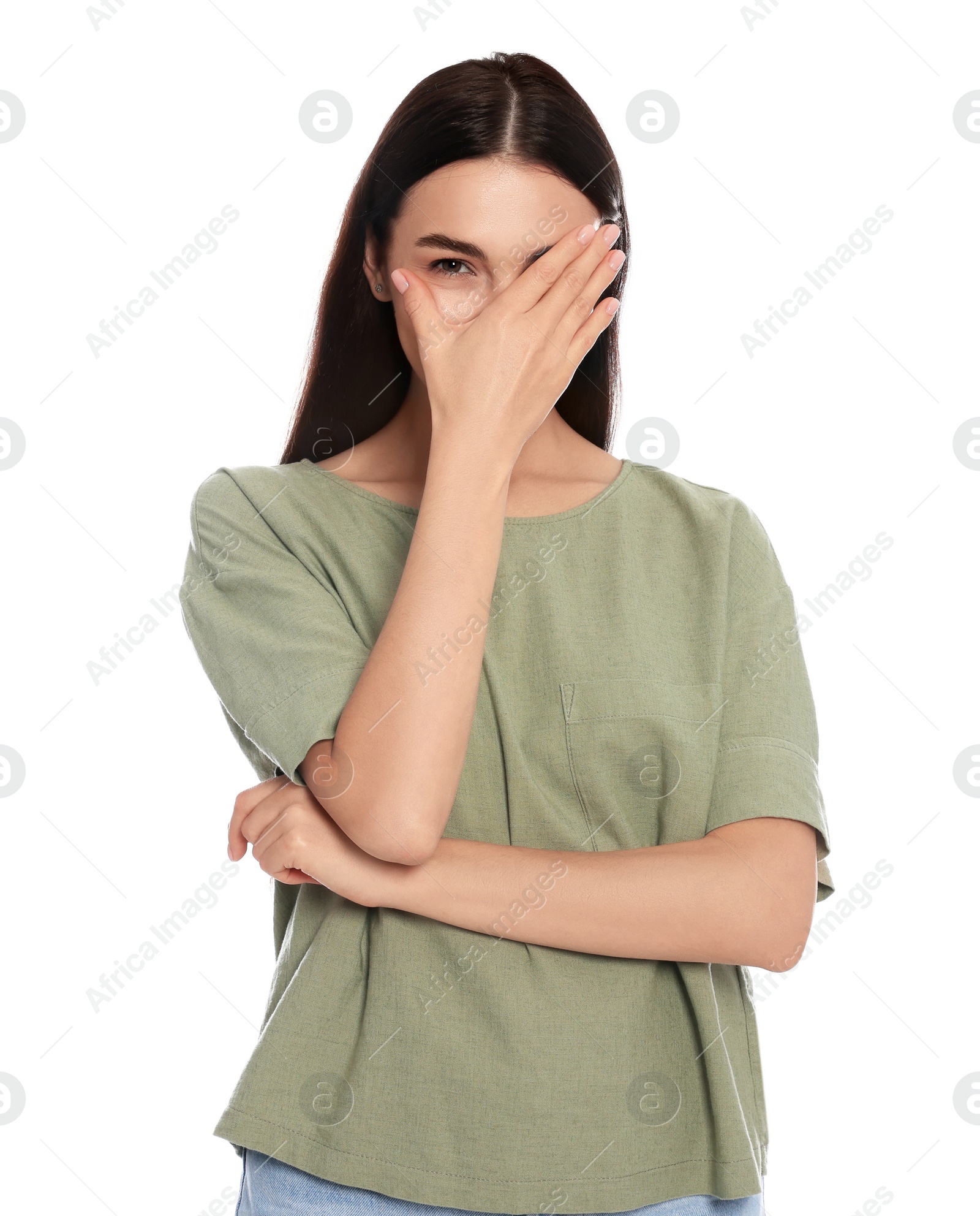 Photo of Embarrassed woman covering face with hand on white background