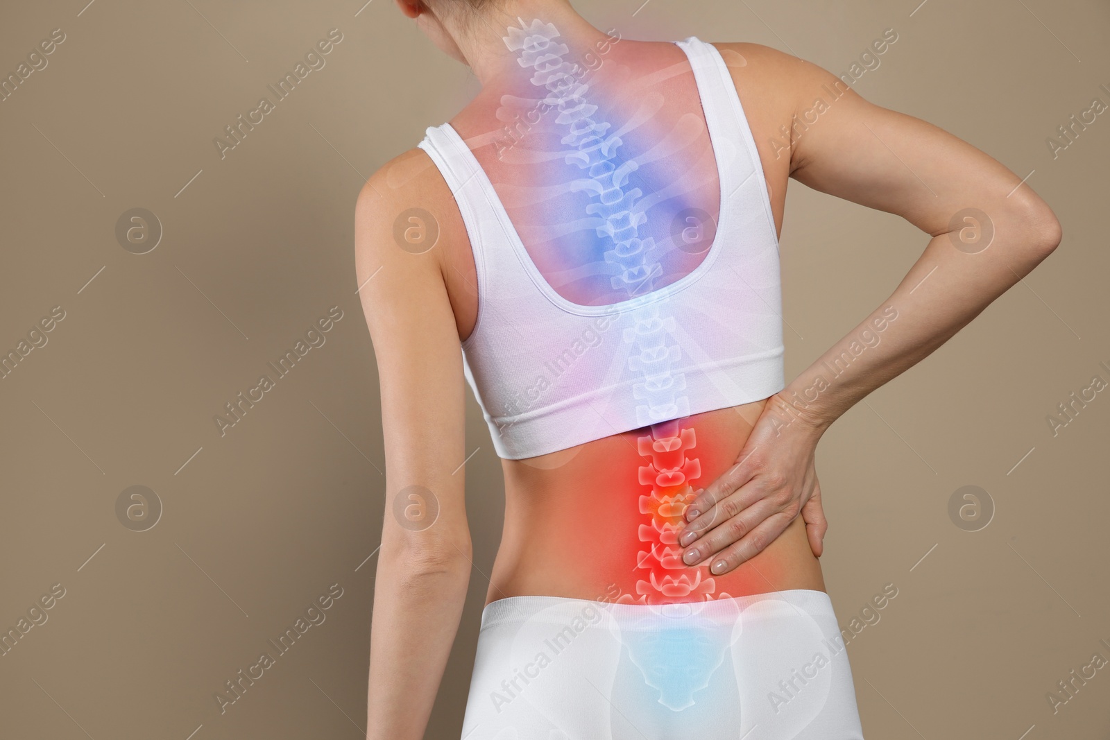 Image of Woman suffering from pain in back on beige background, closeup