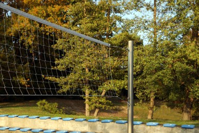 View of volleyball court with net outdoors