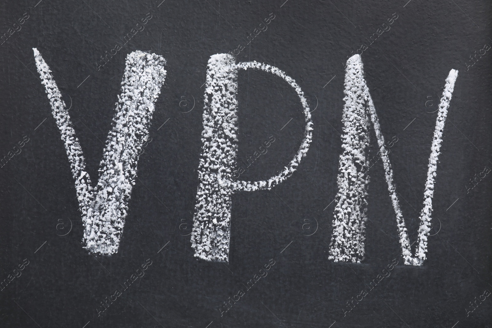 Photo of Acronym VPN written on black chalkboard, top view