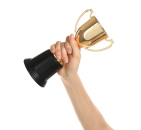 Young woman holding gold trophy cup on white background, closeup