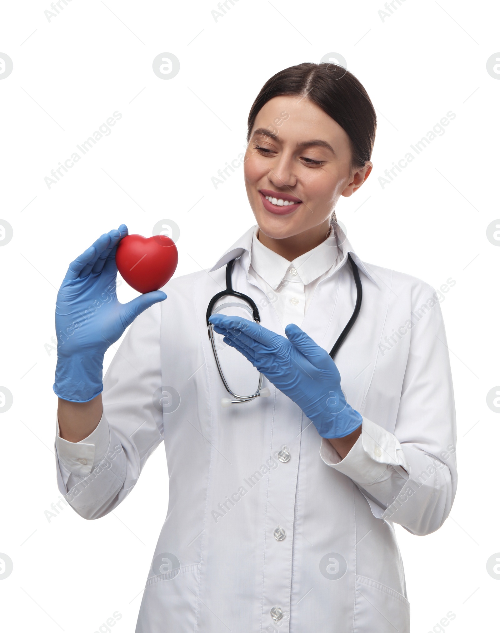 Photo of Doctor with stethoscope and red heart on white background. Cardiology concept