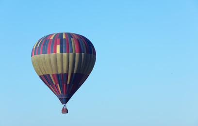 Photo of Beautiful viewhot air balloon in blue sky. Space for text