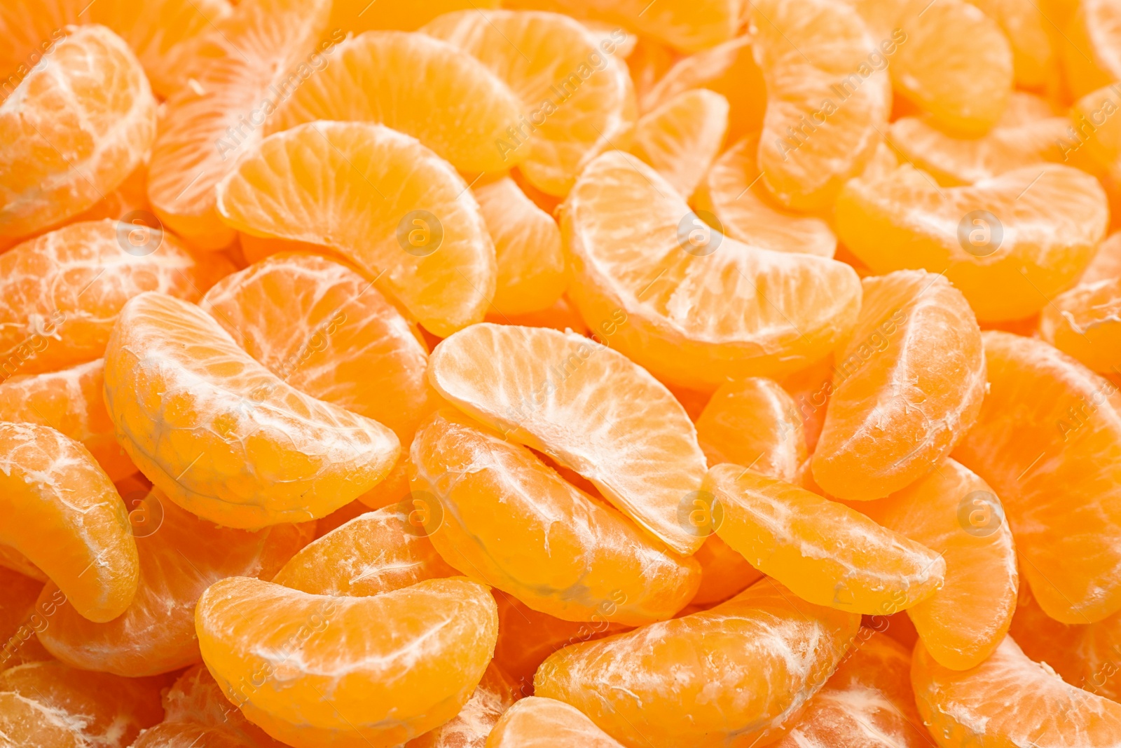 Photo of Fresh juicy tangerine segments as background, closeup