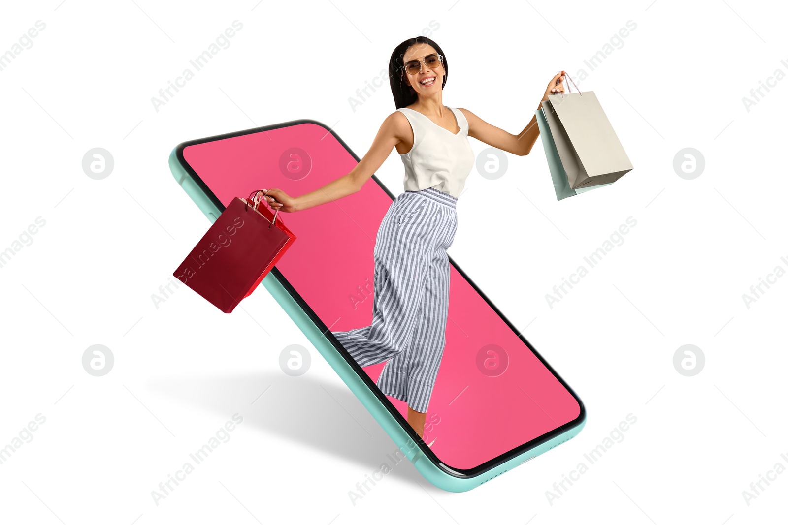 Image of Online shopping. Happy woman with paper bags jumping out from smartphone on white background