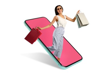 Online shopping. Happy woman with paper bags jumping out from smartphone on white background