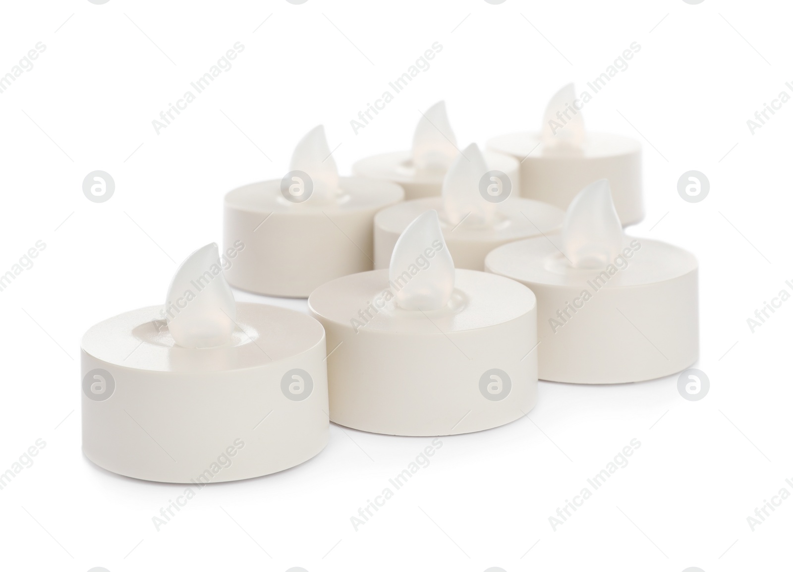 Photo of Decorative flameless LED candles on white background