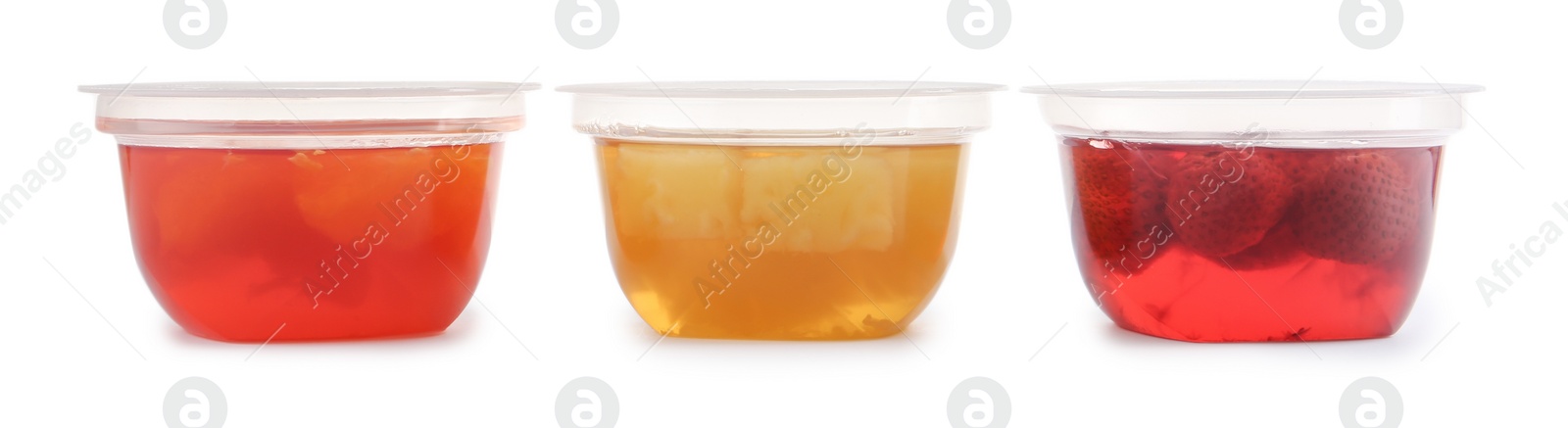 Photo of Tasty jelly desserts in plastic cups on white background