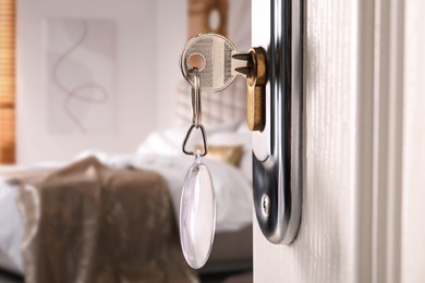 Image of Closeup view of door with key open in bedroom 