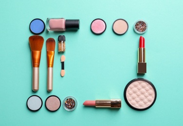 Photo of Flat lay composition with decorative cosmetics on color background