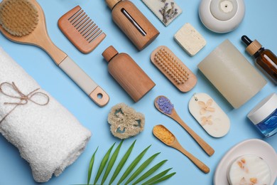 Photo of Flat lay composition with different spa products on light blue background