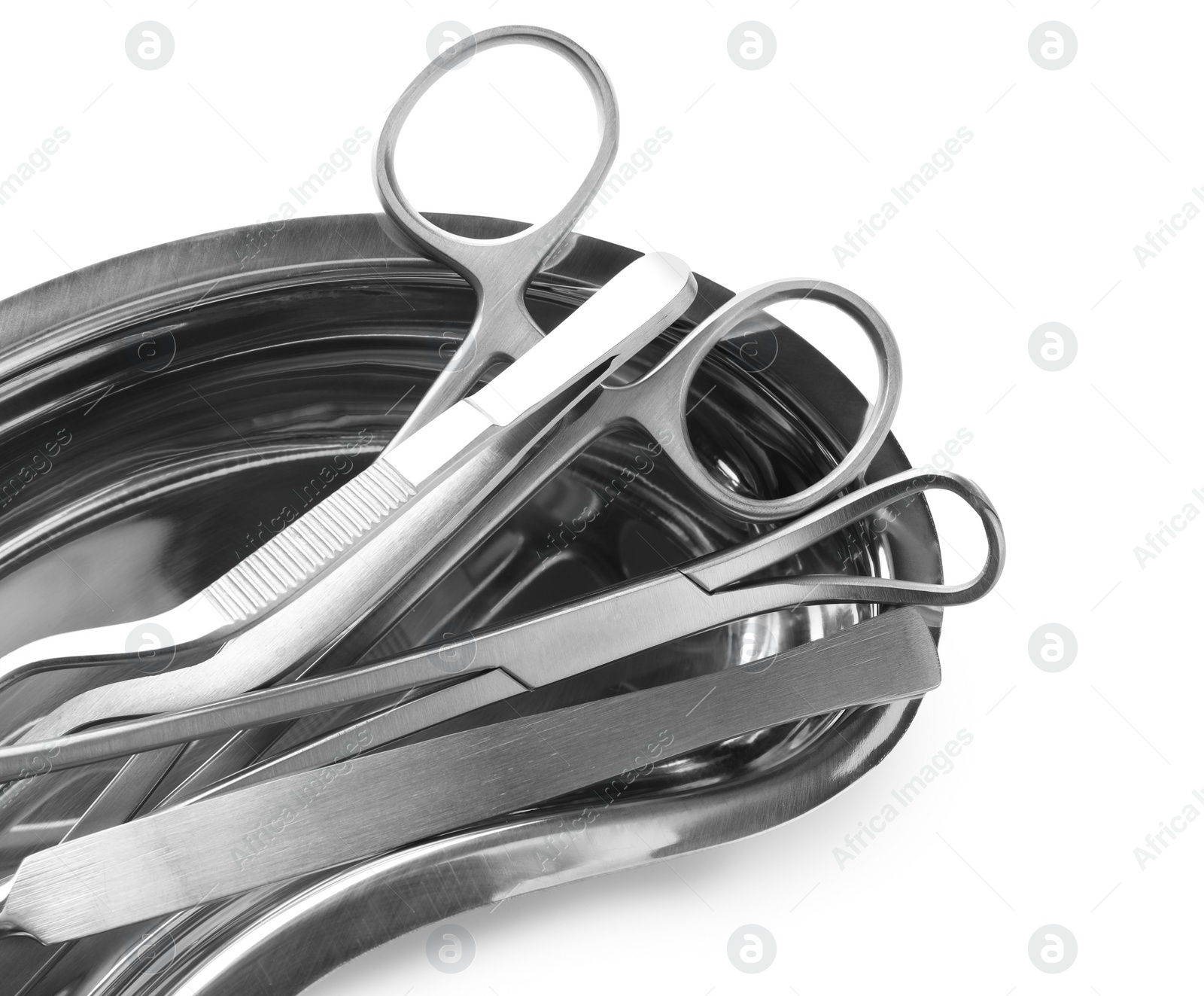 Photo of Surgical instruments in kidney dish on white background, top view