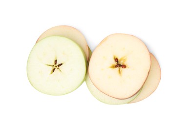 Photo of Slices of ripe apples isolated on white, top view