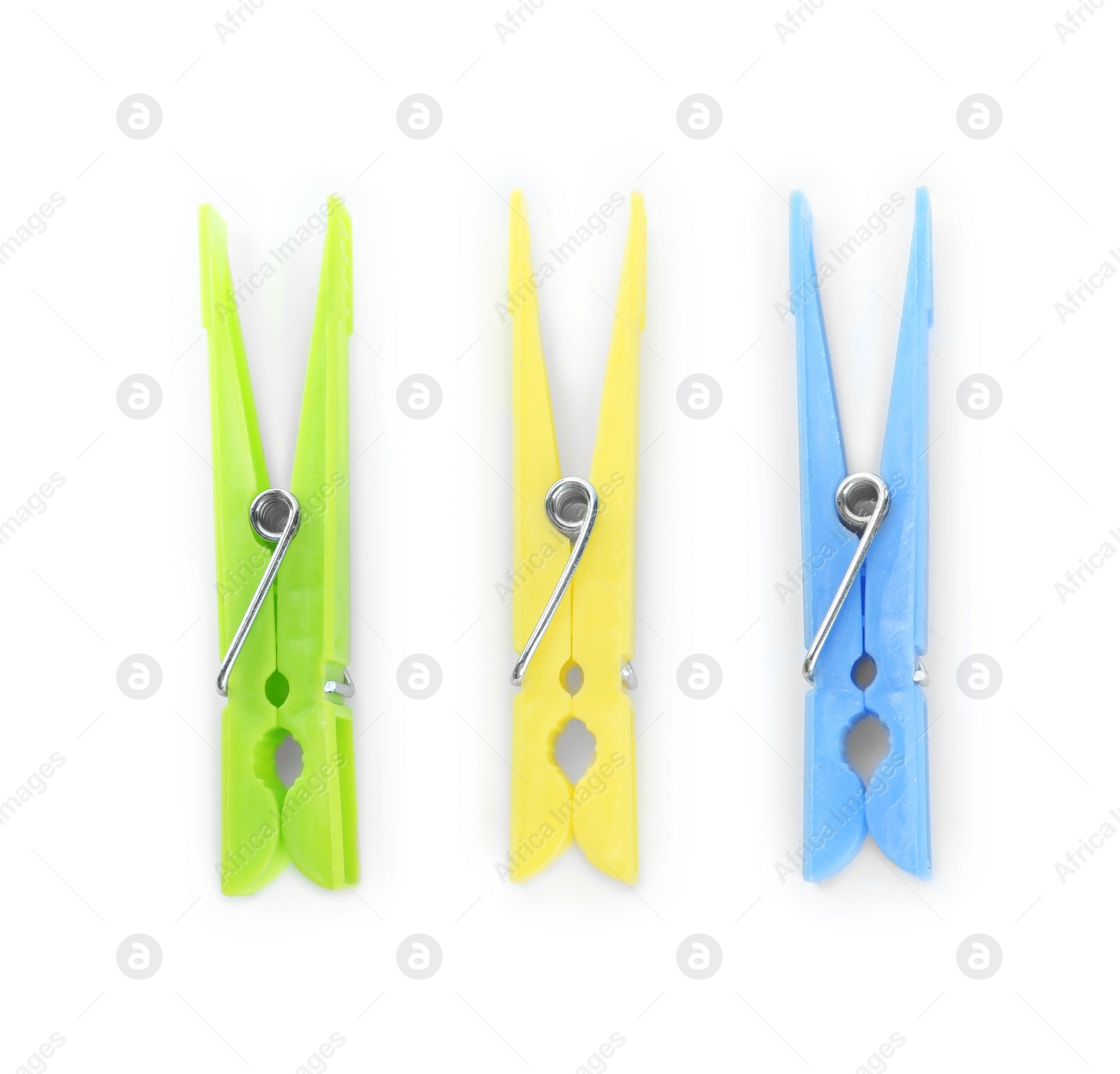 Photo of Colorful plastic clothespins on white background, top view