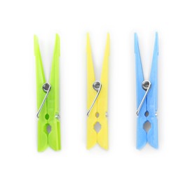 Photo of Colorful plastic clothespins on white background, top view