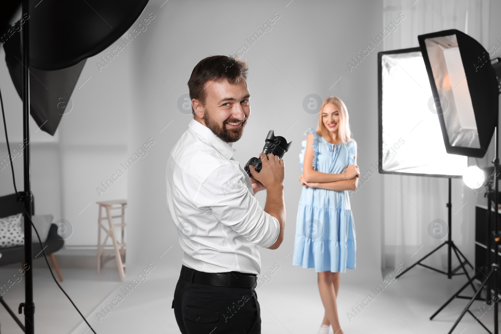 Photo of Beautiful model posing for professional photographer in studio