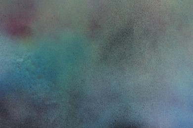 Photo of Texture of abstract spray paint as background, top view